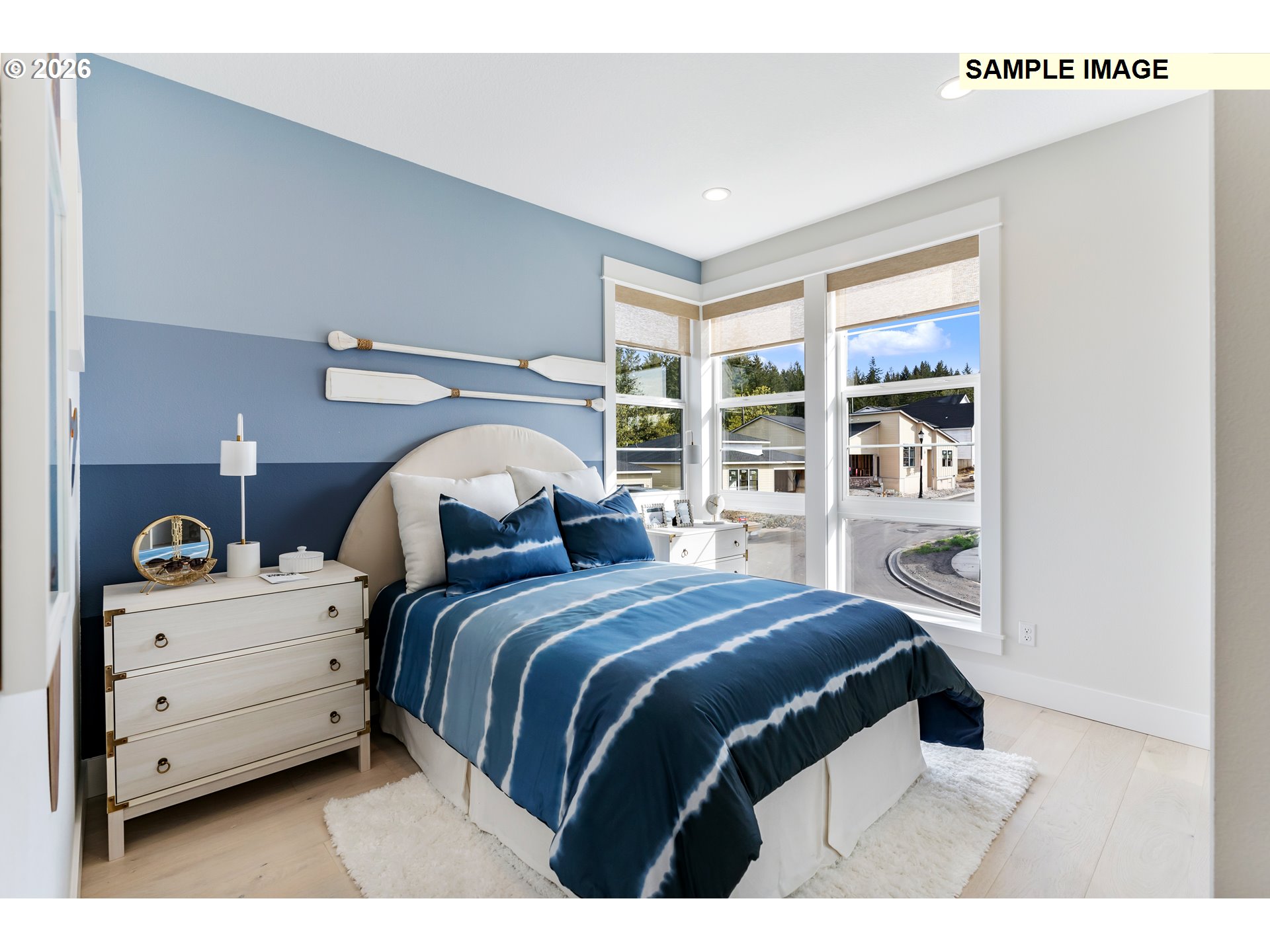 1509 South Creekview Place, Unit L6 Ridgefield, WA 98642 - Photo 25 of 43 a bedroom with a bed and a large window
