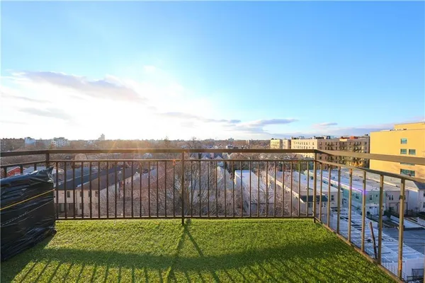 a view of a backyard with a lake view