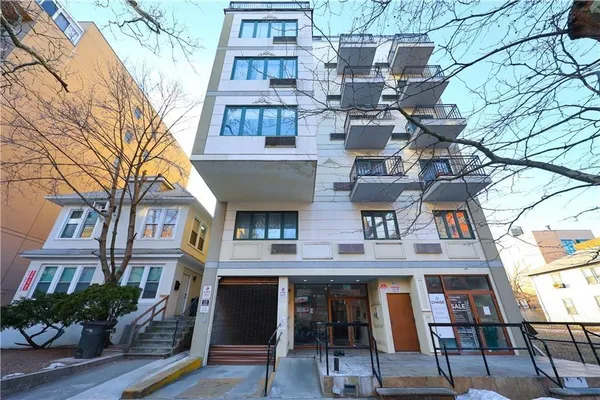 a bricked building with multiple glass windows