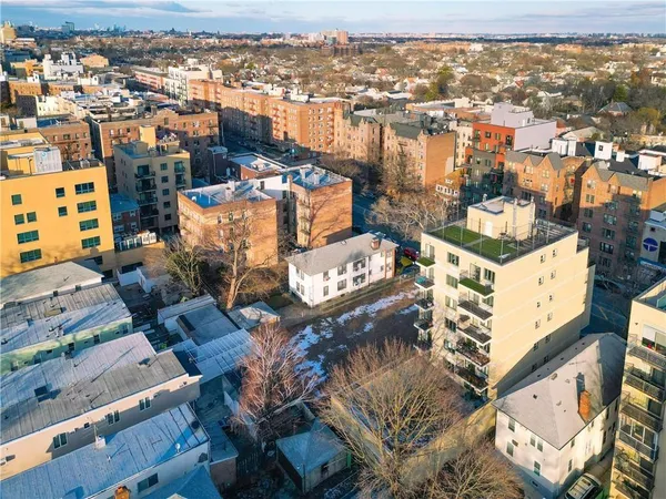 an aerial view of a city with parking