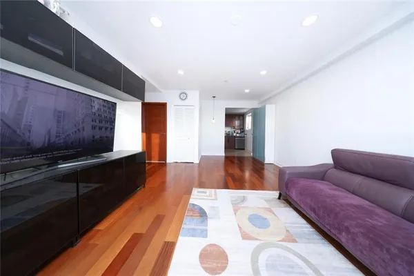 a living room with furniture and a rug
