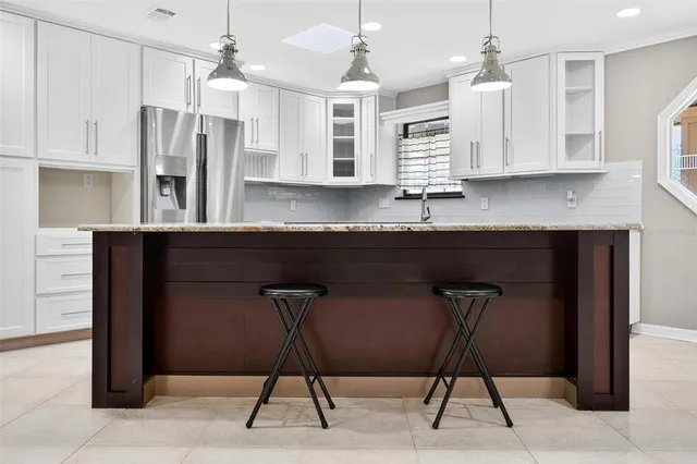a view of a livingroom with furniture and a table
