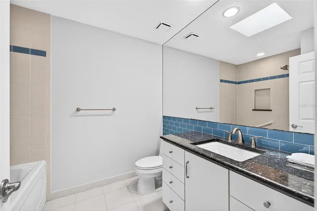 a view of house with garden space and street view