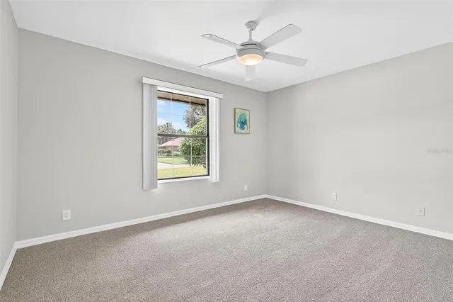 an aerial view of a house with garden space and street view