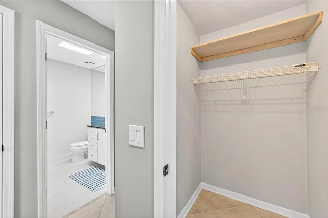 an aerial view of lake residential houses with outdoor space and swimming pool