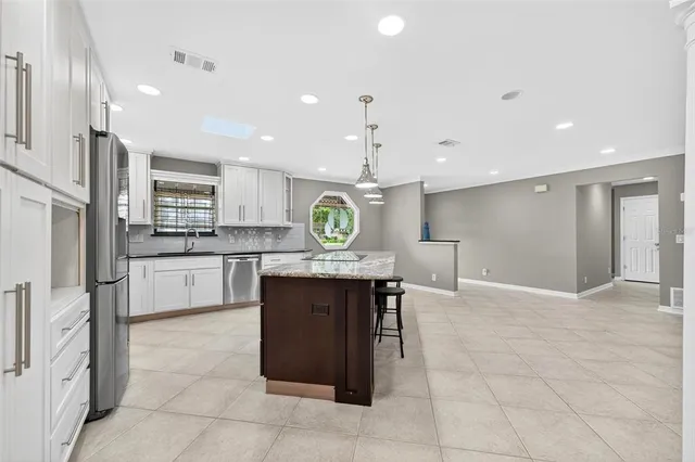 a kitchen with a stove and a sink