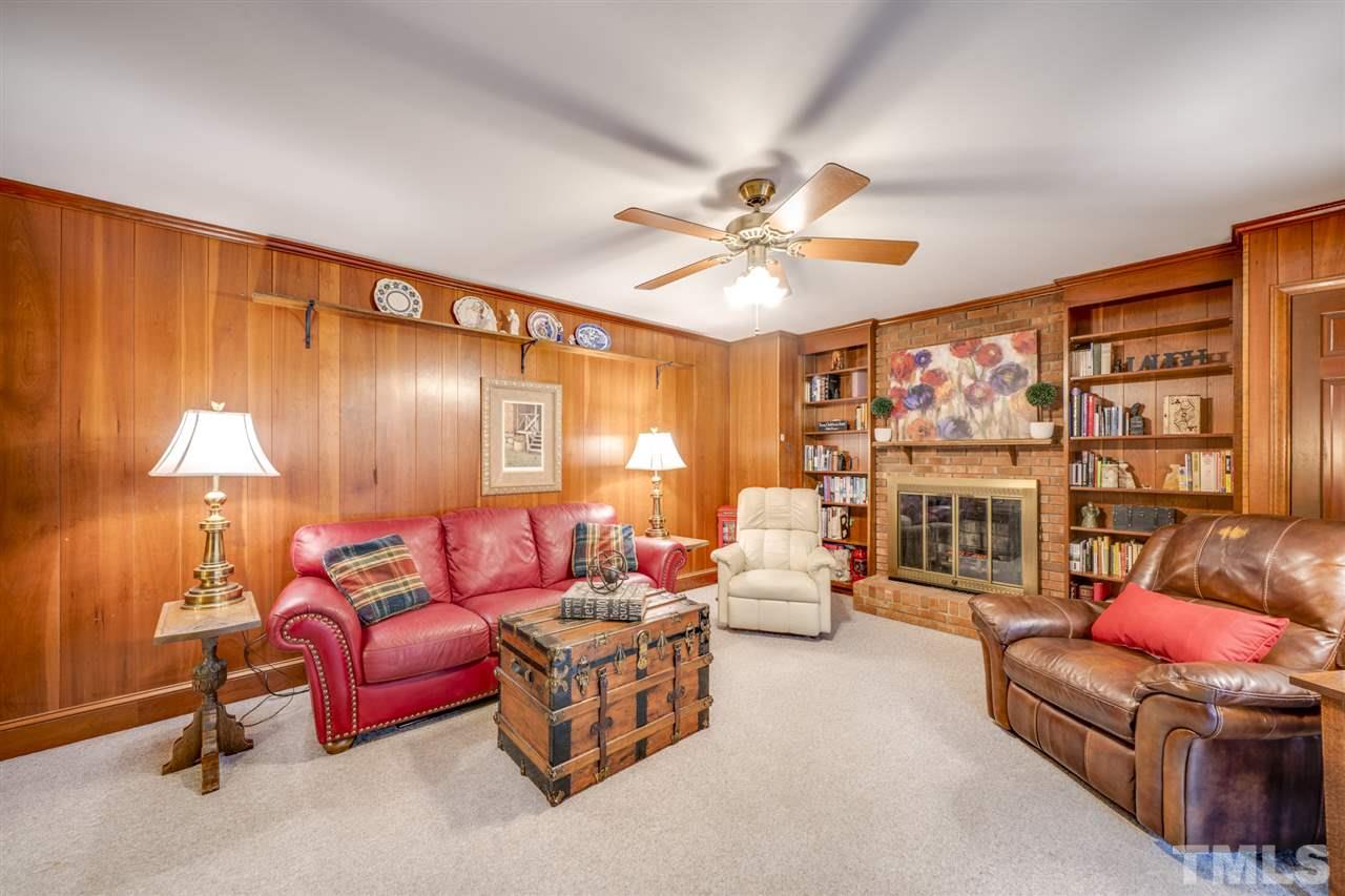 4616 Fernham Place Raleigh, NC 27612 - Photo 16 of 26 a living room with furniture and a large window