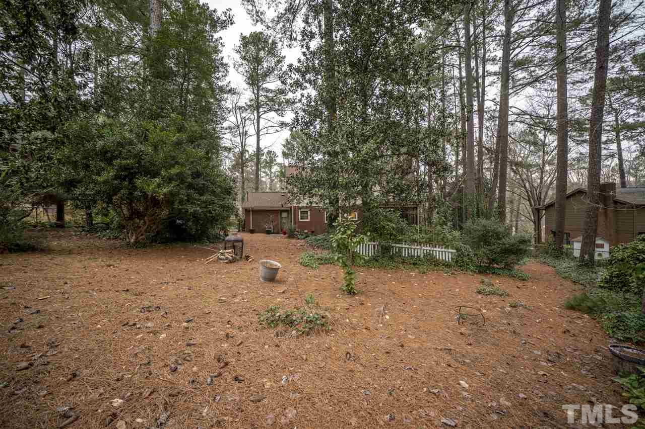 4616 Fernham Place Raleigh, NC 27612 - Photo 25 of 26 a view of a yard with a tree