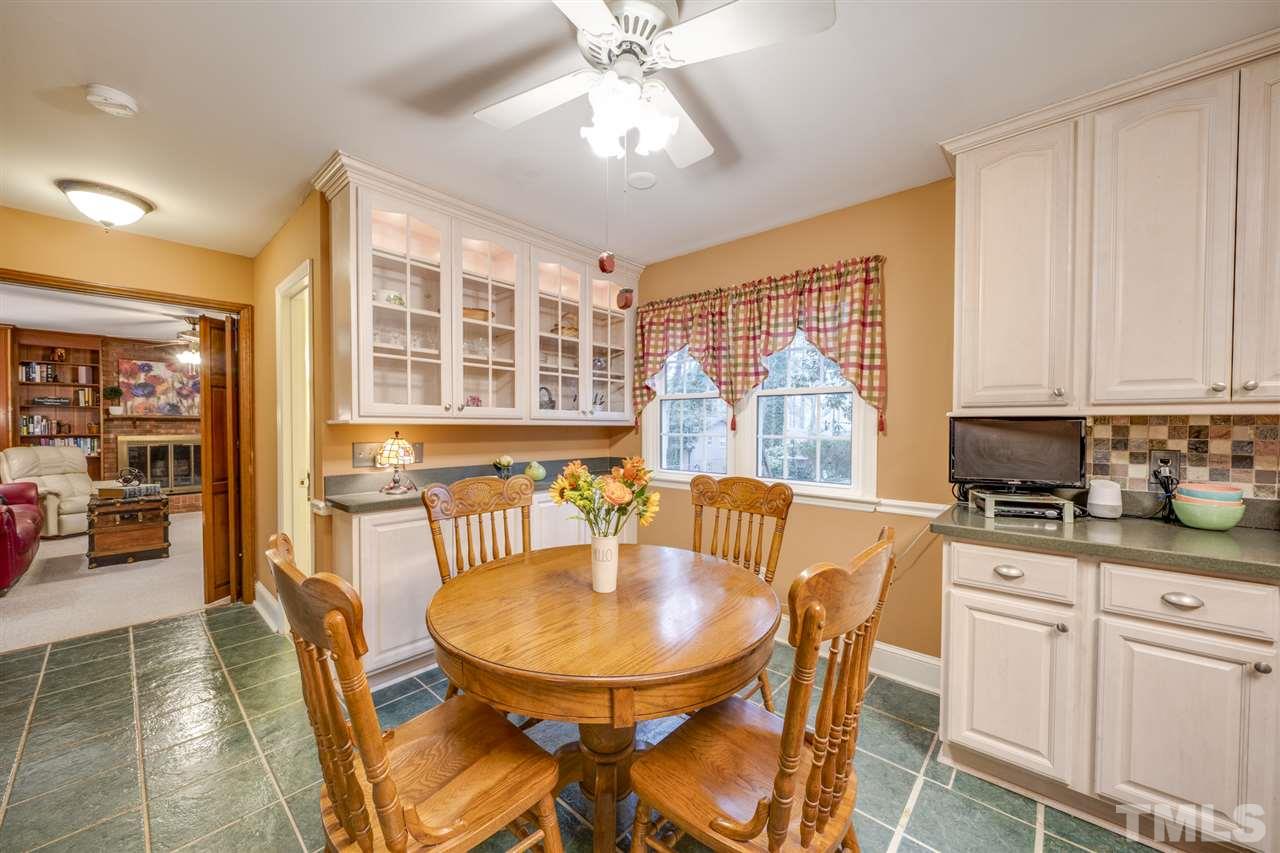 4616 Fernham Place Raleigh, NC 27612 - Photo 5 of 26 a view of a dining room with furniture window and outside view
