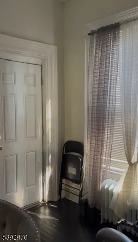 a view of a livingroom with furniture and staircase