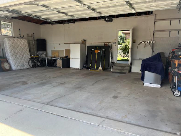 2329 Sublette Place Sandy, UT 84093 - Photo 55 of 56 Attached garage featuring concrete flooring and a pedestrian door