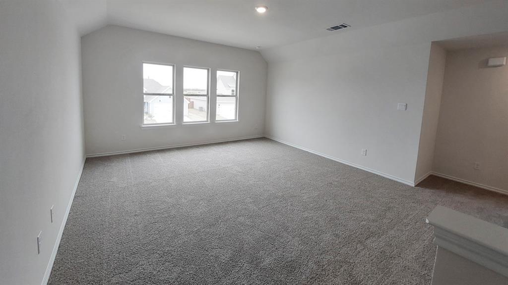 821 Lantana Lane Pilot Point, TX 76258 - Photo 11 of 17 an empty room with windows