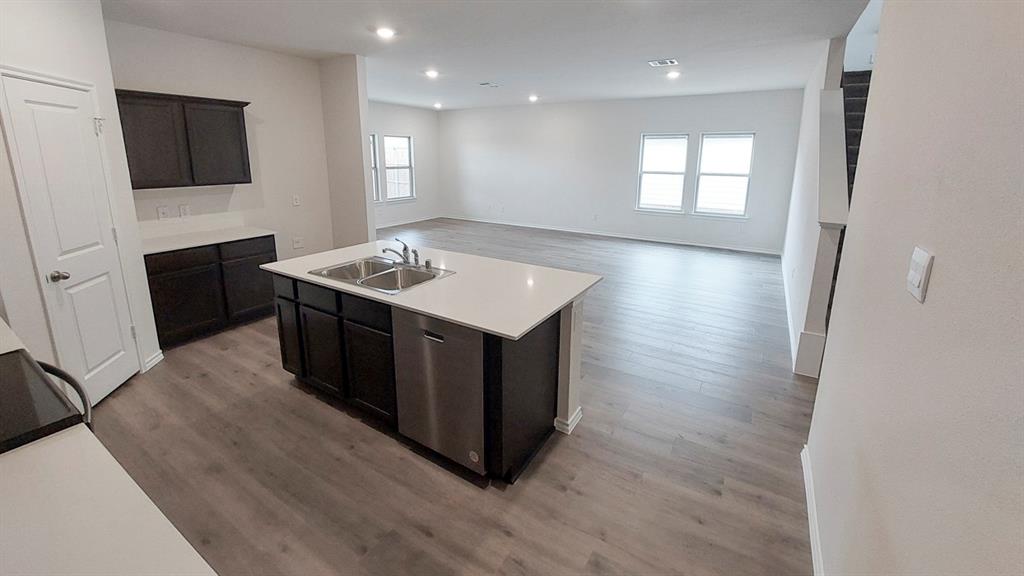821 Lantana Lane Pilot Point, TX 76258 - Photo 12 of 17 a kitchen with a stove and a refrigerator