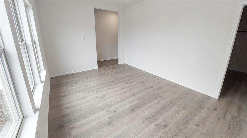 821 Lantana Lane Pilot Point, TX 76258 - Photo 4 of 17 an empty room with wooden floor