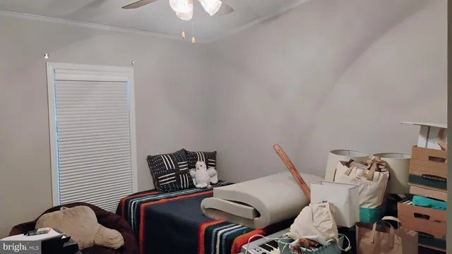 a bed room with a bed and a chair