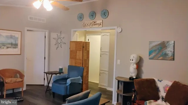 a view of a livingroom with furniture and workspace