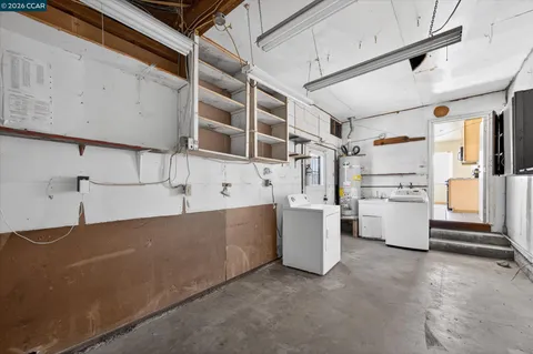 a view of utility room and cabinets