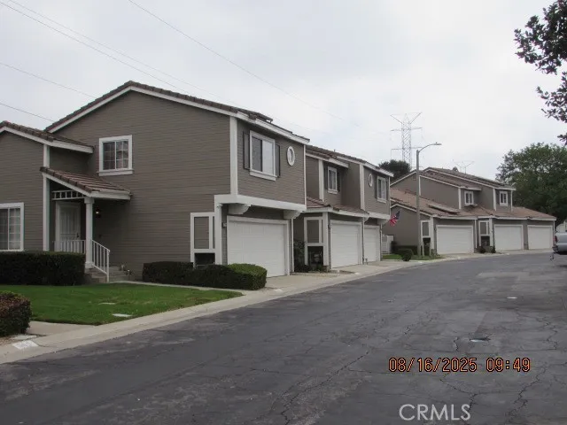 a front view of residential houses with yard