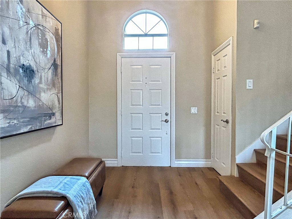 555 Canyon Hill Road San Dimas, CA 91773 - Photo 14 of 16 a view of room with window and wooden floor
