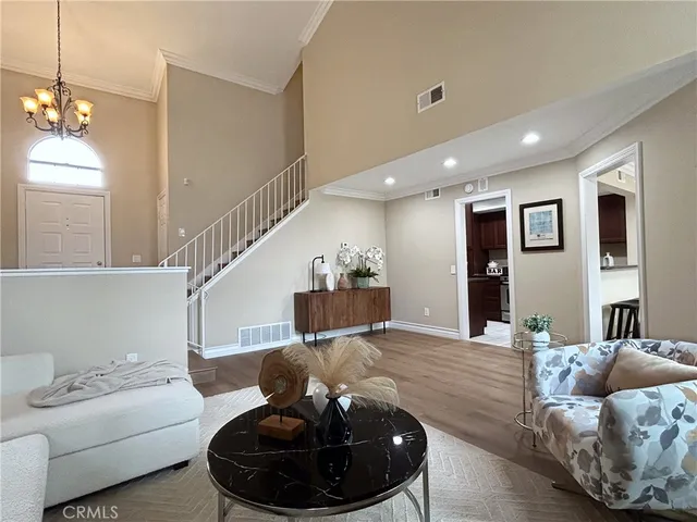 a living room with furniture and a lamp