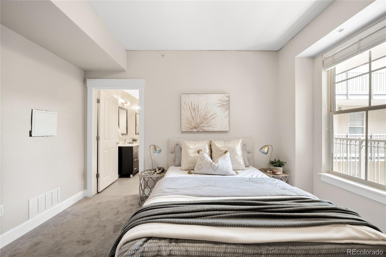 1699 North Downing Street, Unit 306 Denver, CO 80218 - Photo 17 of 26 a bedroom with a bed and a window