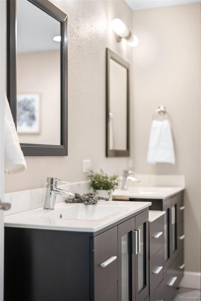 1699 North Downing Street, Unit 306 Denver, CO 80218 - Photo 20 of 26 a bathroom with a sink and a mirror