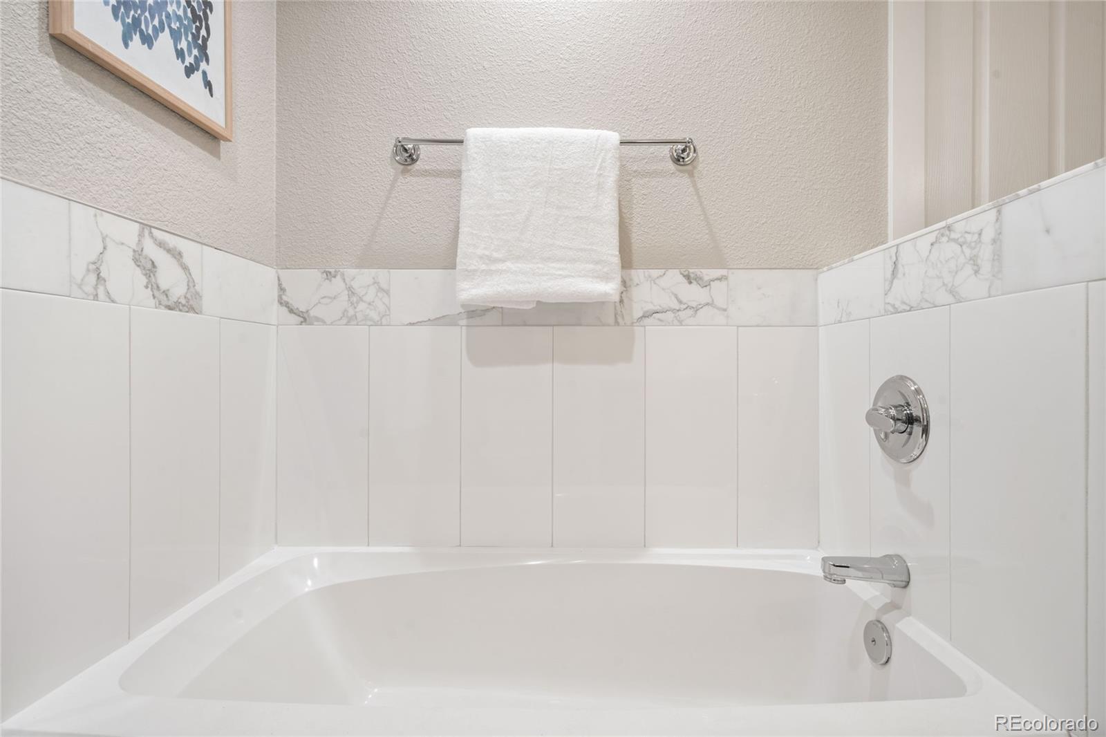 1699 North Downing Street, Unit 306 Denver, CO 80218 - Photo 21 of 26 a bathroom with a bathtub
