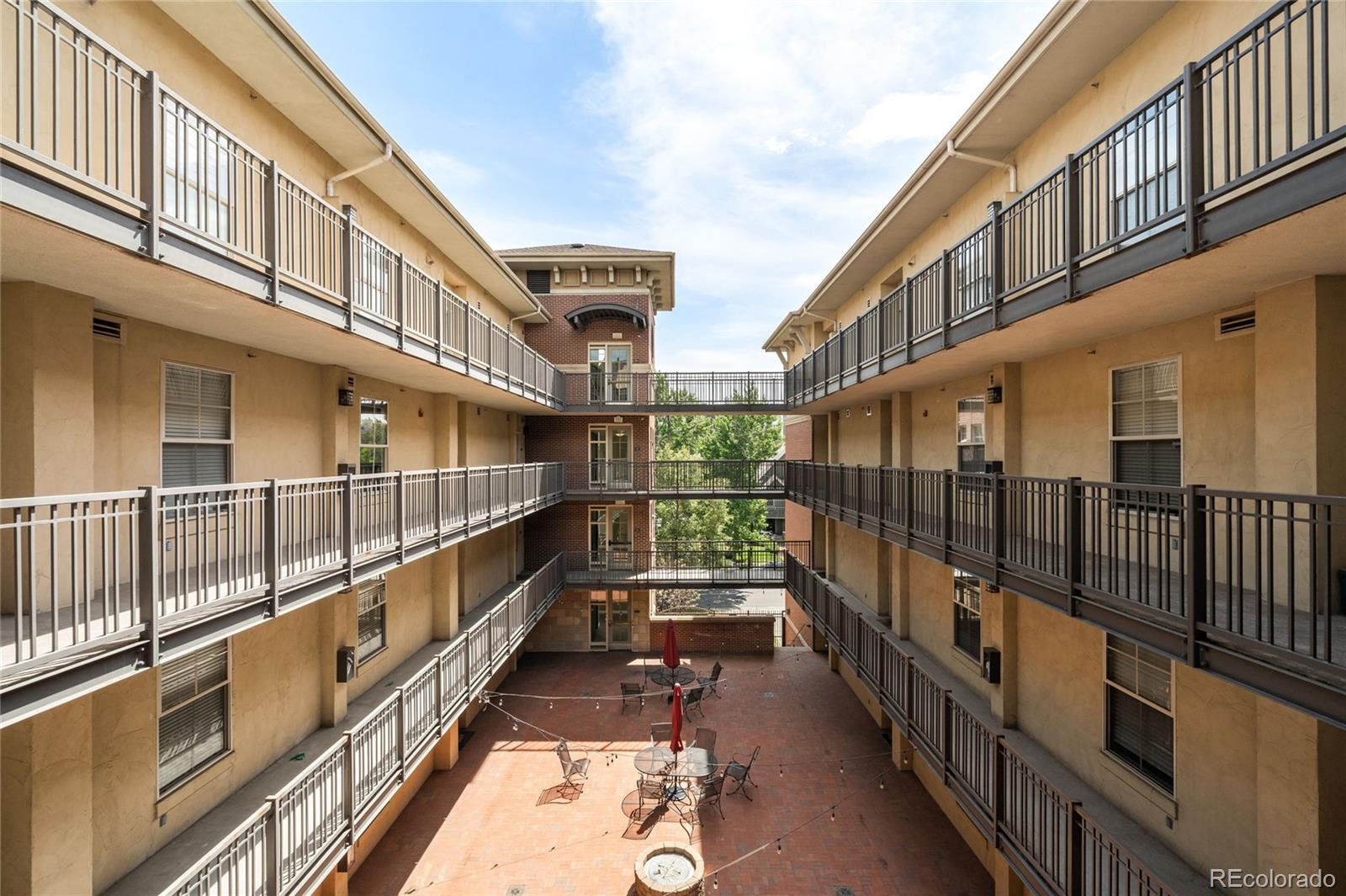 1699 North Downing Street, Unit 306 Denver, CO 80218 - Photo 24 of 26 a view of a balcony with wooden floor