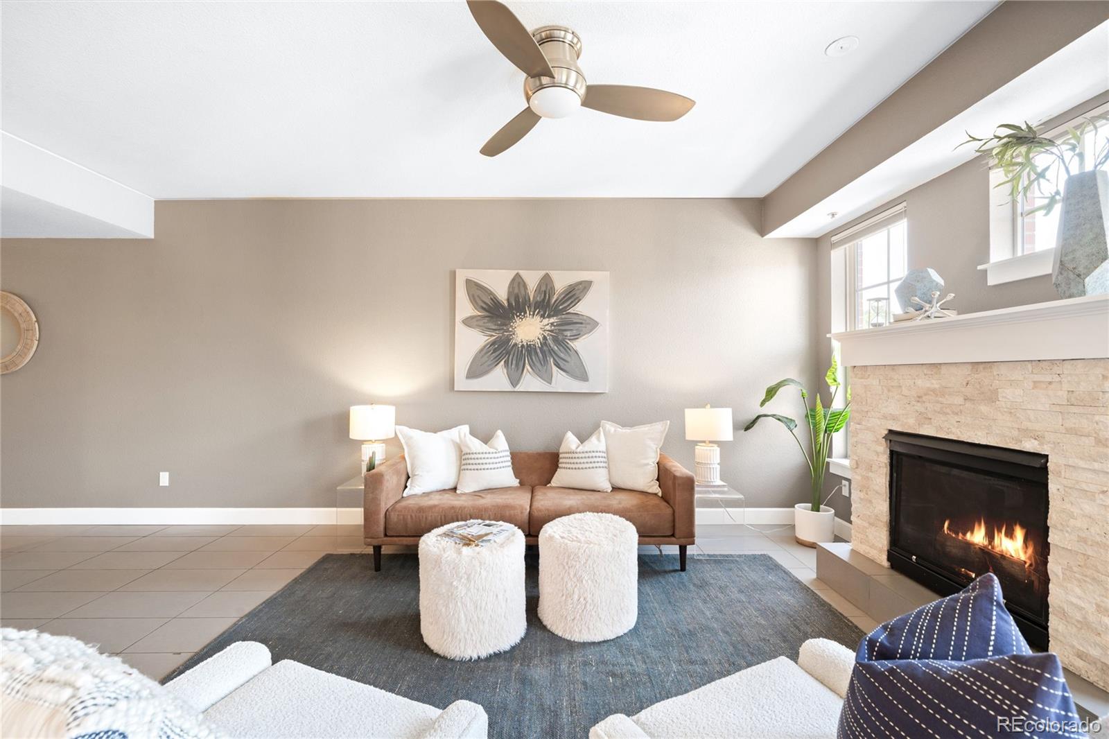 1699 North Downing Street, Unit 306 Denver, CO 80218 - Photo 4 of 26 a living room with furniture and a fireplace