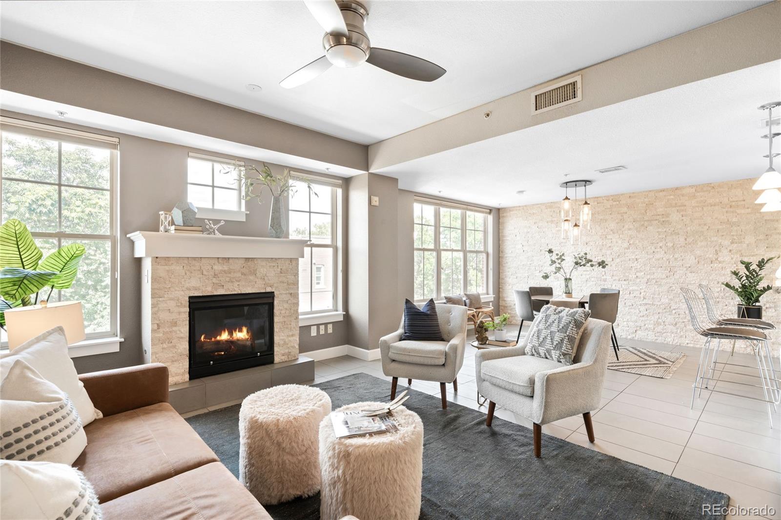 1699 North Downing Street, Unit 306 Denver, CO 80218 - Photo 5 of 26 a living room with furniture and a fireplace