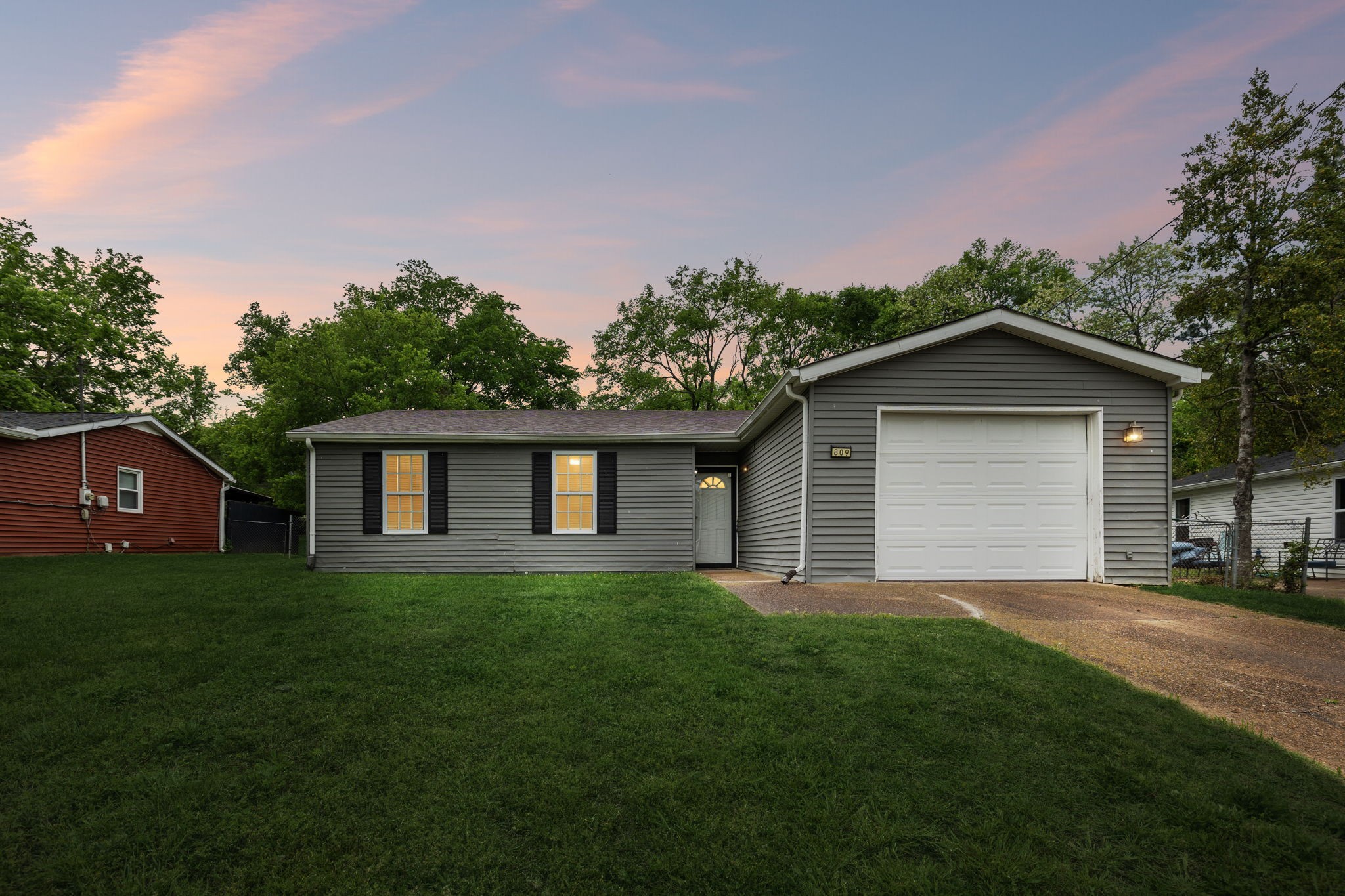 809 Fawn Lane Madison, TN 37115 - Photo 1 of 43 a house with green field in front of it