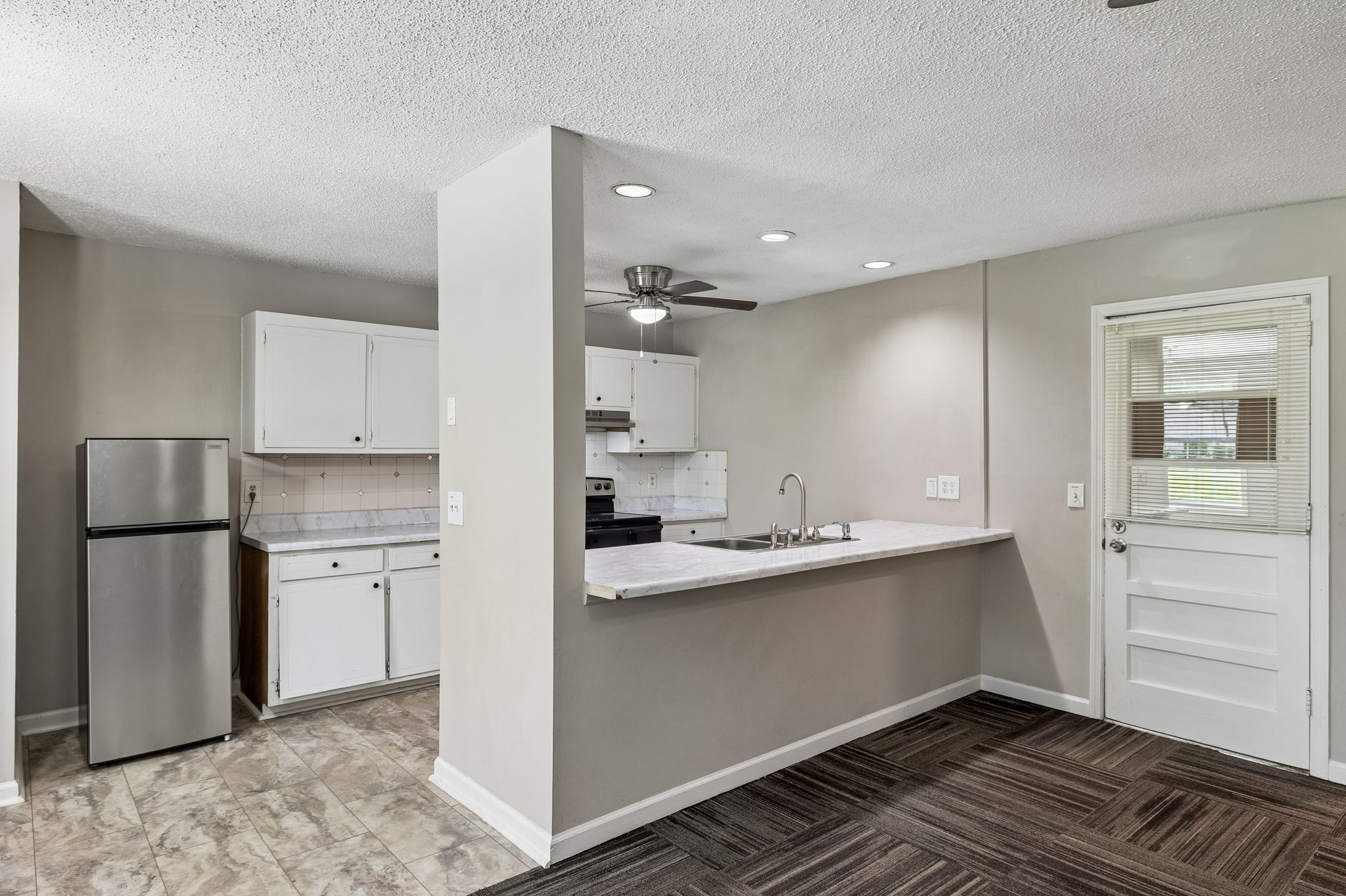 809 Fawn Lane Madison, TN 37115 - Photo 12 of 43 a kitchen with a sink stainless steel appliances and cabinets