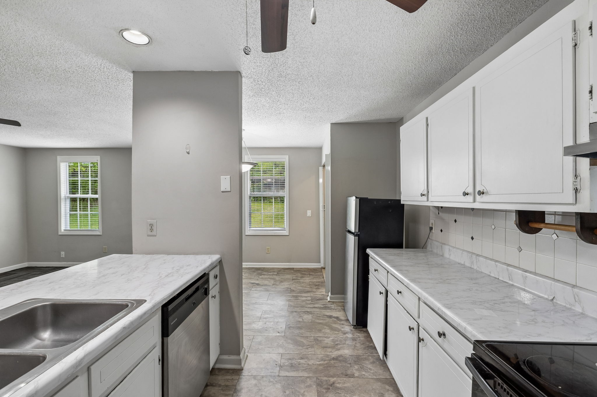 809 Fawn Lane Madison, TN 37115 - Photo 16 of 43 a kitchen that has a sink and a stove in it