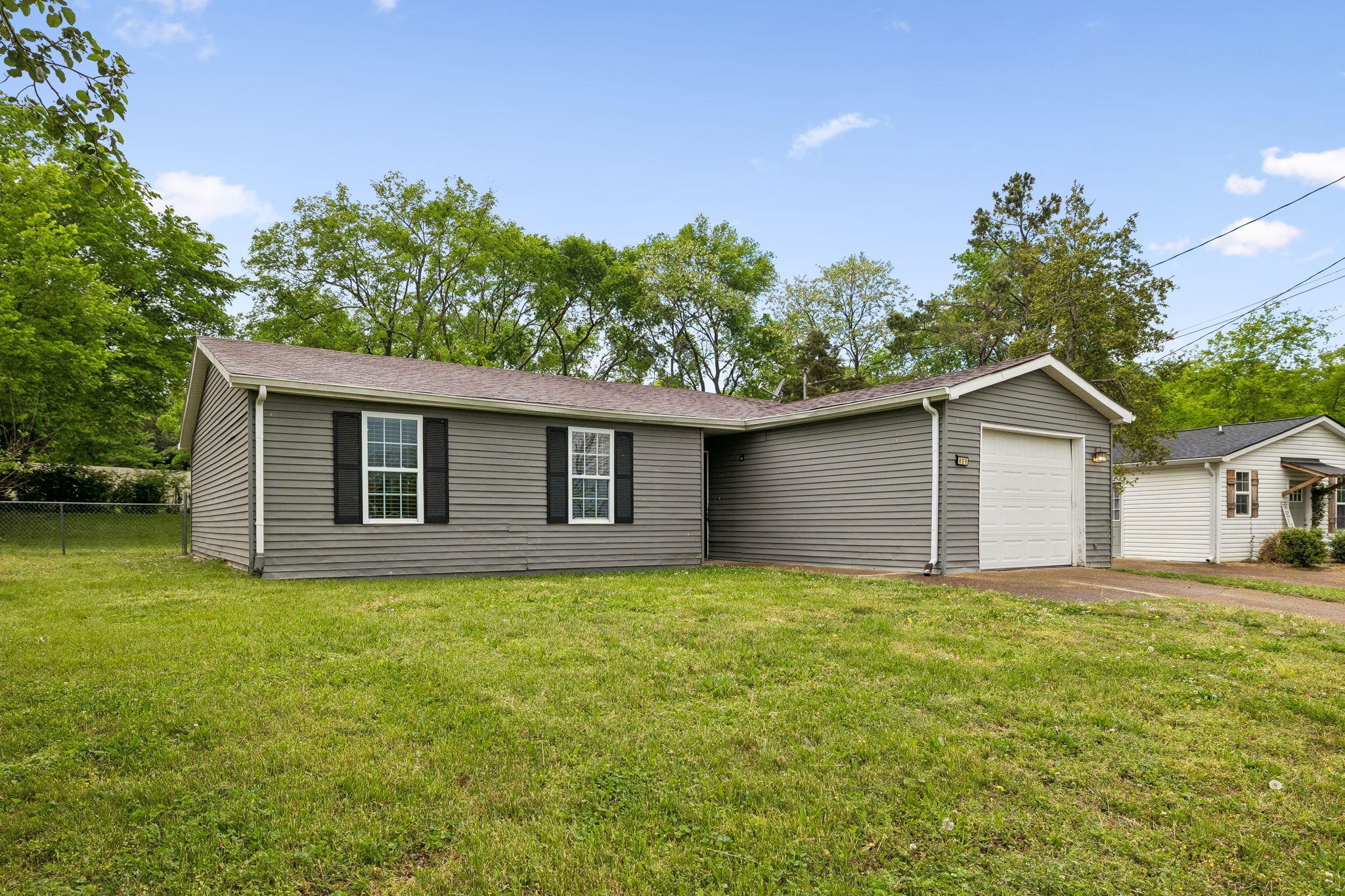 809 Fawn Lane Madison, TN 37115 - Photo 2 of 43 a house with trees in the background