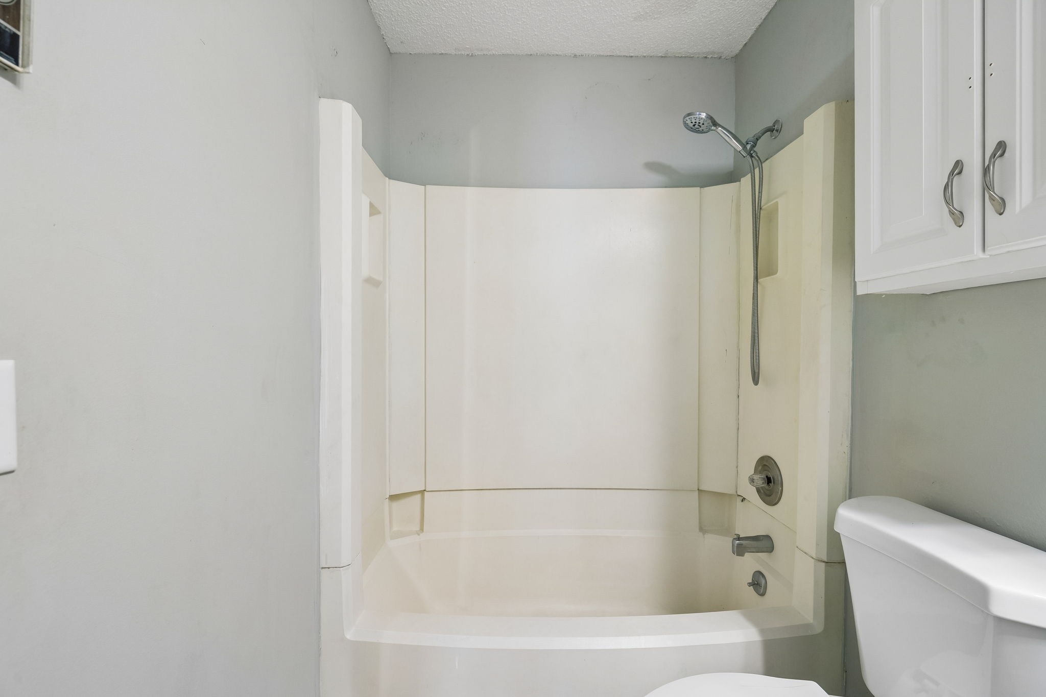 809 Fawn Lane Madison, TN 37115 - Photo 23 of 43 a white bath tub sitting next to a white toilet