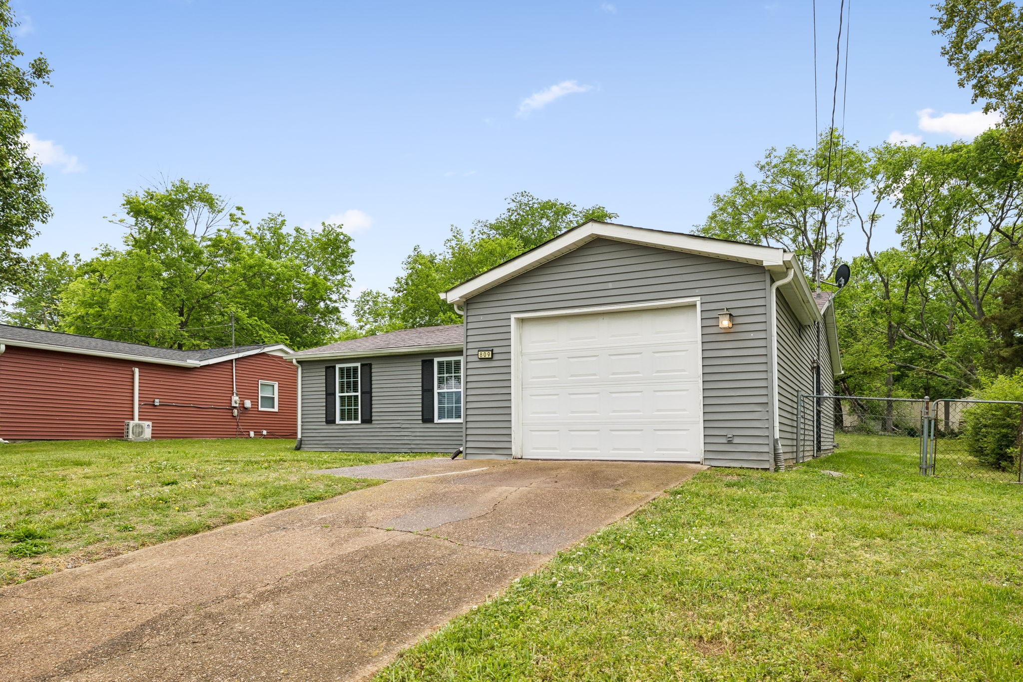 809 Fawn Lane Madison, TN 37115 - Photo 3 of 43 a front view of house with yard and trees in the background