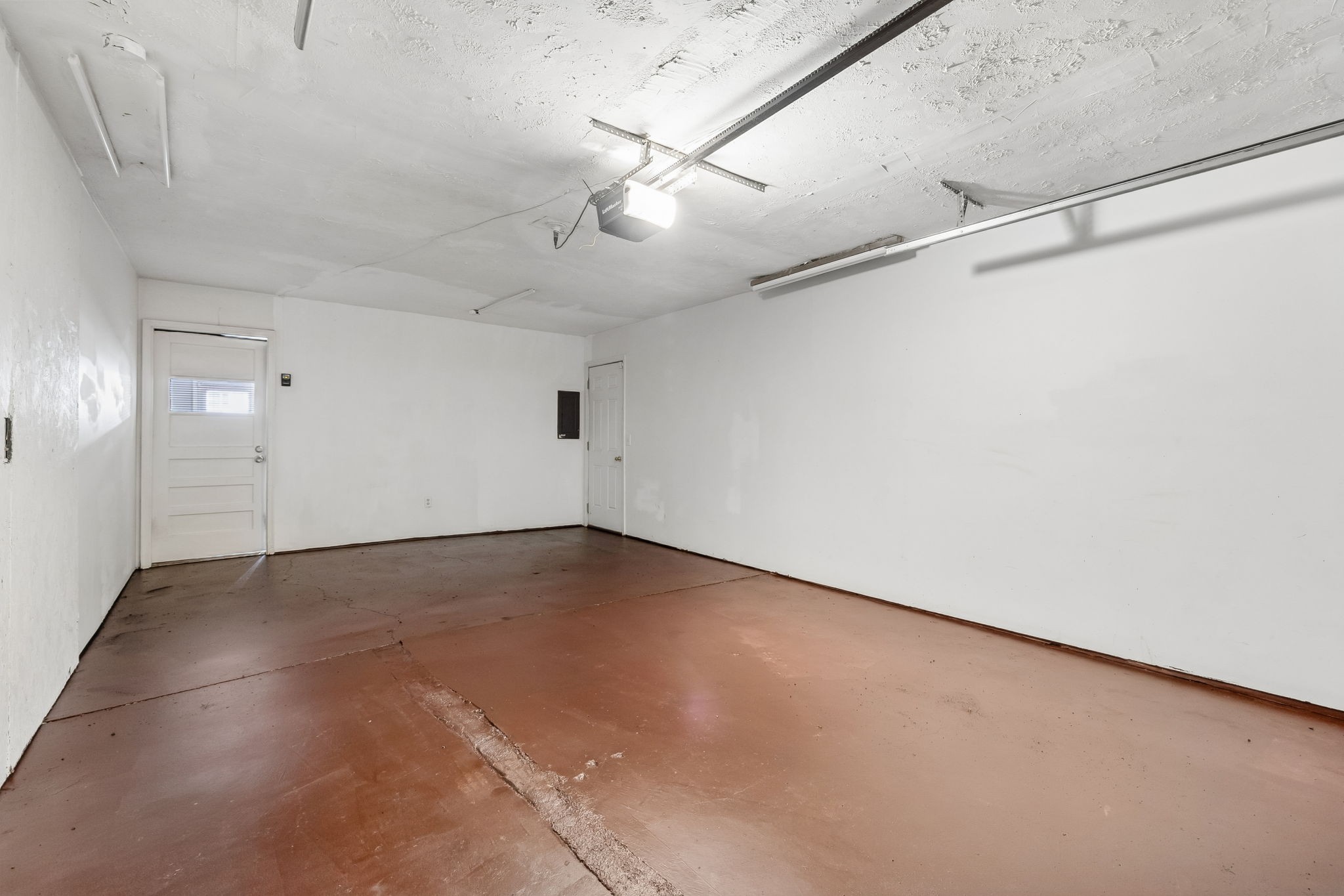 809 Fawn Lane Madison, TN 37115 - Photo 31 of 43 an empty room with a ceiling fan and wooden floor