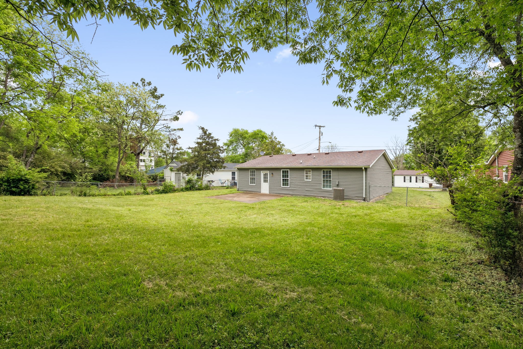 809 Fawn Lane Madison, TN 37115 - Photo 37 of 43 a view of a big house with a big yard and large trees