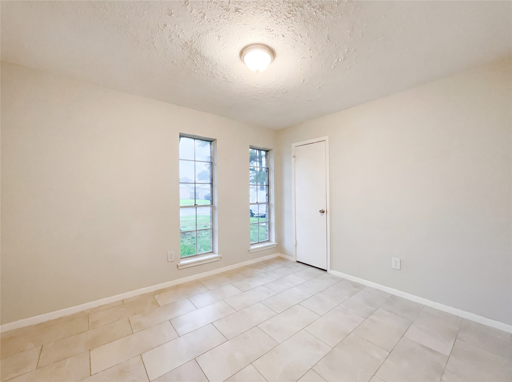 23110 Pennsgrove Road Spring, TX 77373 - Photo 4 of 16 an empty room with windows