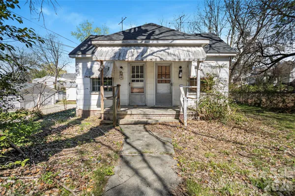 a view of a house with yard and covered with snow