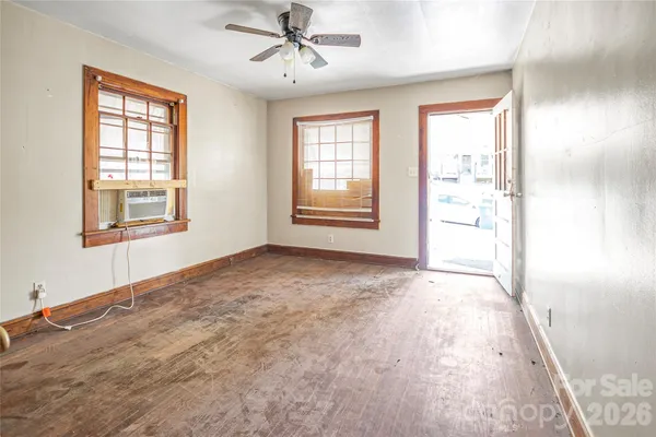 a view of an empty room with a window