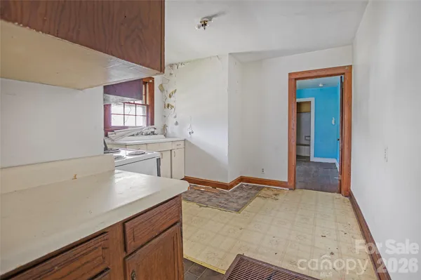 a kitchen with a sink stove and cabinets