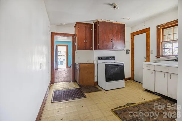 a kitchen with sink and cabinets