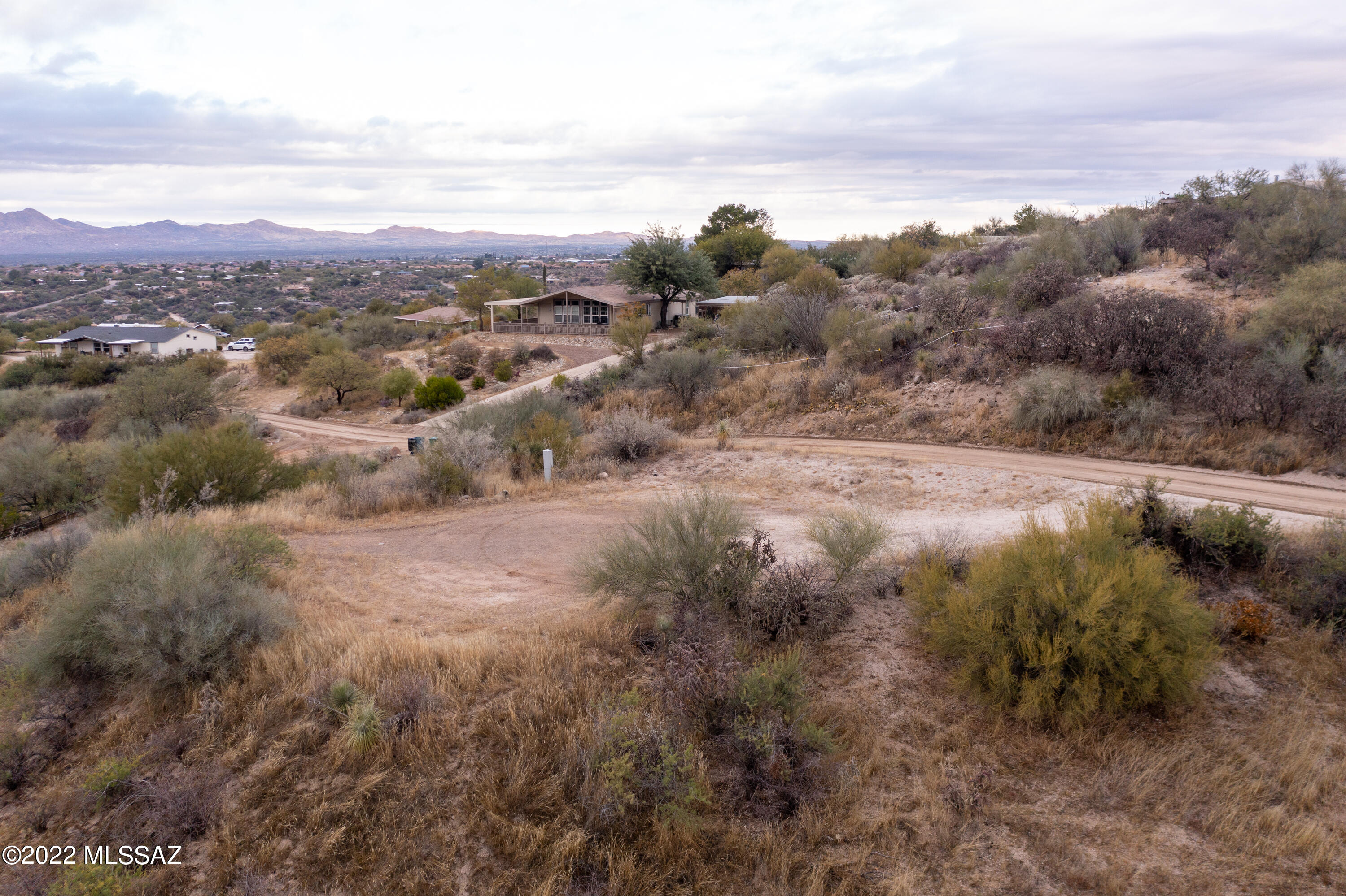 14597 North Swan Road Tucson, AZ 85739 - Photo 26 of 34 an aerial view of forest with houses