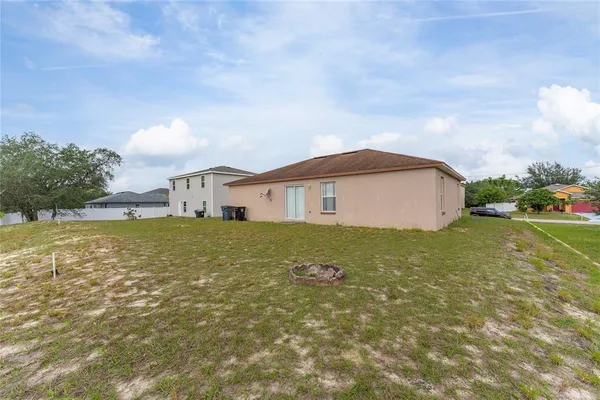 a view of a house with a yard and garage