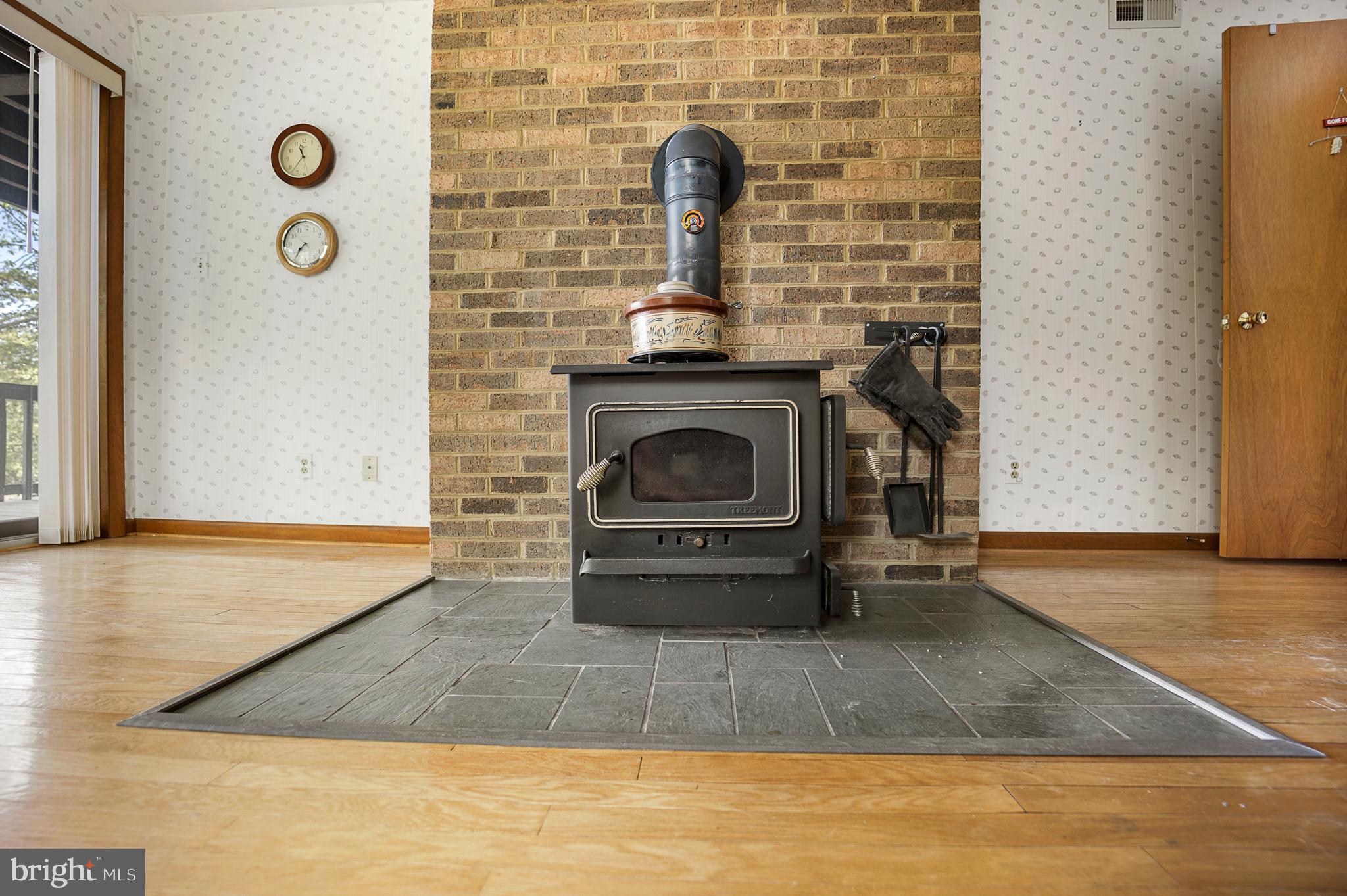 1405 Crabhouse Road Lusby, MD 20657 - Photo 38 of 47 Wood stove in lower level den/office