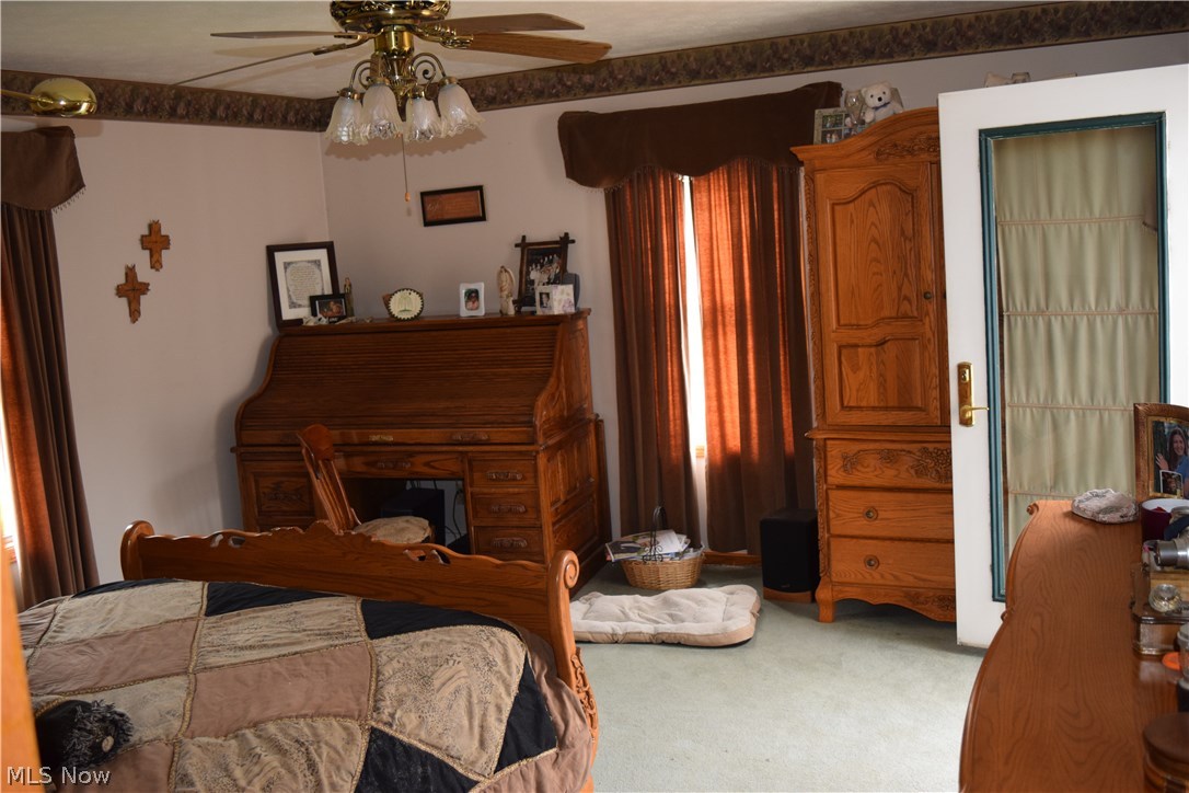 9752 Stone Road Litchfield, OH 44253 - Photo 18 of 30 Master first floor bedroom, w/en suite and walk in closet, has access to back deck