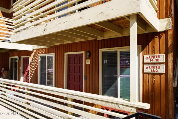 a view of a chair and door