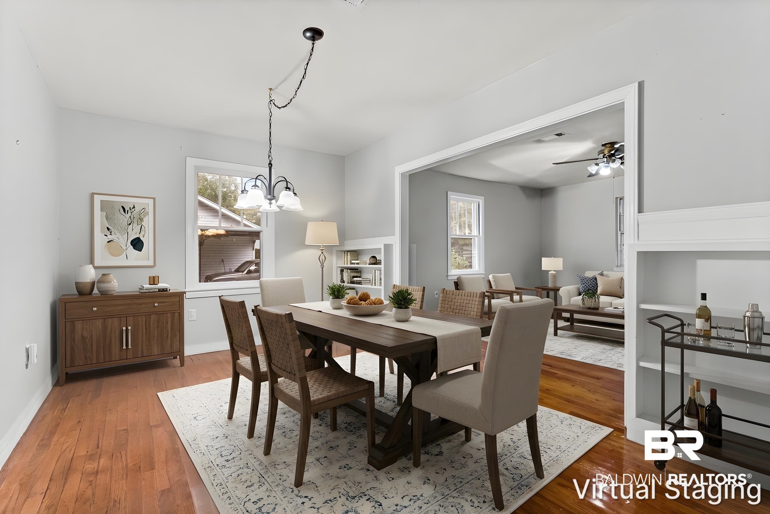 312 Sutherland Drive Mobile, AL 36611 - Photo 9 of 28 Virtually staged dining area featuring wood-finish flooring, a chandelier, and a wide cased opening to an additional living space