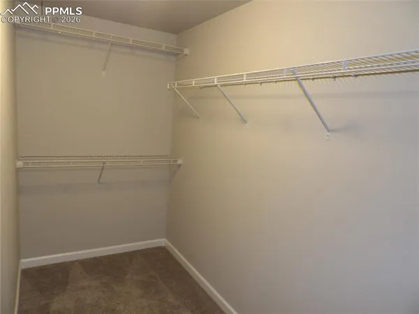 a view of a room with racks on the wall